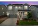 Charming two-story home with a well-manicured lawn and welcoming front porch at 52 Simmental Loop, Castle Rock, CO 80104