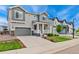 Charming two-story home with a welcoming front porch and well-manicured landscaping at 52 Simmental Loop, Castle Rock, CO 80104
