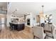 Modern kitchen with stainless steel appliances, granite countertops, and island with seating at 52 Simmental Loop, Castle Rock, CO 80104