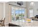 Bright kitchen with granite counters, island, stainless appliances, and a view to the outside deck at 52 Simmental Loop, Castle Rock, CO 80104