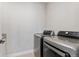 Laundry room with side-by-side washer and dryer, offering convenience and efficiency at 52 Simmental Loop, Castle Rock, CO 80104
