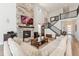 Cozy living room featuring a grand fireplace, staircase, and comfortable furnishings at 52 Simmental Loop, Castle Rock, CO 80104
