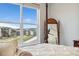Bright main bedroom with a neighborhood view and a decorative mirror at 52 Simmental Loop, Castle Rock, CO 80104