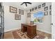 Charming home office featuring built in shelves, a comfortable desk, a ceiling fan, and a bright window at 52 Simmental Loop, Castle Rock, CO 80104