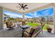 Covered patio area perfect for outdoor entertaining, complete with seating and neighborhood views at 52 Simmental Loop, Castle Rock, CO 80104