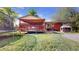 The backyard features a deck, fire pit, trampoline, playhouse, lawn, and a privacy fence at 821 Clarkson Ct, Denver, CO 80229