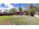 The backyard features a deck, fire pit, trampoline, playhouse, lawn, and a privacy fence at 821 Clarkson Ct, Denver, CO 80229
