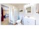 Modern bathroom with a glass block partition and a stylish vanity at 821 Clarkson Ct, Denver, CO 80229