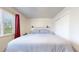 Serene bedroom with soft carpeting, a queen-sized bed, and natural light at 821 Clarkson Ct, Denver, CO 80229