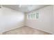 This bedroom features a window and neutral walls with carpet flooring at 821 Clarkson Ct, Denver, CO 80229