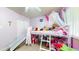 This bedroom includes a lofted bed with slide and built-in storage at 821 Clarkson Ct, Denver, CO 80229