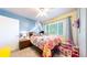 Bright bedroom with a ceiling fan, window, and charming canopy bed at 821 Clarkson Ct, Denver, CO 80229