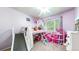 bedroom includes a lofted bed with slide and a bright playroom area at 821 Clarkson Ct, Denver, CO 80229