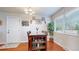 Bright dining room with a wooden table, seating for six, and a large window at 821 Clarkson Ct, Denver, CO 80229