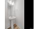 Simple pedestal sink in well-lit bathroom at 1164 Sugarloaf Ln, Erie, CO 80516