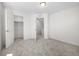 Bright bedroom features neutral carpet, closet, and access to the upper floor at 1164 Sugarloaf Ln, Erie, CO 80516
