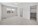 Well-lit bedroom with large windows and a walk-in closet at 1164 Sugarloaf Ln, Erie, CO 80516