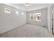 Neutral bedroom with multiple windows for natural light and neutral carpeting at 1164 Sugarloaf Ln, Erie, CO 80516