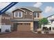 New two-story home featuring a two-car garage and neutral toned exterior with well manicured landscaping at 1164 Sugarloaf Ln, Erie, CO 80516