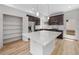 Bright kitchen features a large island, stainless steel appliances, and pantry with ample storage at 1164 Sugarloaf Ln, Erie, CO 80516
