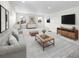 Bright and airy living room with contemporary furnishings and decor at 1164 Sugarloaf Ln, Erie, CO 80516