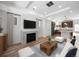 Open concept living room with modern fireplace and kitchen at 1164 Sugarloaf Ln, Erie, CO 80516