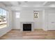 Bright living room features a tiled fireplace, recessed lighting, and hardwood floors at 1164 Sugarloaf Ln, Erie, CO 80516