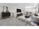 Modern living room with stylish furniture, decor, and plenty of natural light at 1164 Sugarloaf Ln, Erie, CO 80516