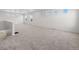 Spacious living room with neutral carpet, multiple windows, and a staircase at 1164 Sugarloaf Ln, Erie, CO 80516