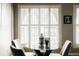 Dining area featuring a glass table, comfortable seating, and natural light at 1555 California St # 609, Denver, CO 80202