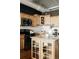Updated kitchen featuring modern stainless steel appliances, light wood cabinetry, and granite countertops at 1555 California St # 609, Denver, CO 80202