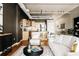 Living room and kitchen featuring wood floors and an open floor plan at 1555 California St # 609, Denver, CO 80202
