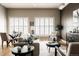 Bright living room with hardwood floors, lots of windows, and stylish furniture at 1555 California St # 609, Denver, CO 80202