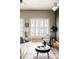 Bright living room features large windows with shutters, hardwood floors, and neutral decor at 1555 California St # 609, Denver, CO 80202