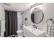 Modern bathroom featuring a shower, vanity, and contemporary finishes at 16029 W 75Th Pl, Arvada, CO 80007