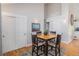 Bright dining area featuring vaulted ceiling and a view of the closet doors at 16029 W 75Th Pl, Arvada, CO 80007