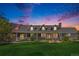Charming single-Gathering home featuring a beautiful front porch, manicured lawn, and picturesque landscaping at 16029 W 75Th Pl, Arvada, CO 80007
