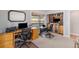 This comfortable home office has custom built-in shelving and is great for working from home at 16029 W 75Th Pl, Arvada, CO 80007