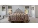Cozy bedroom with a vintage-style trunk at the foot of the bed at 16029 W 75Th Pl, Arvada, CO 80007