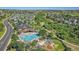 Aerial view of the community pool, clubhouse, and surrounding neighborhood at 23427 Song Bird Hills Pl, Parker, CO 80138