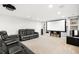 Finished basement with a projector, screen, and plush leather seating at 23427 Song Bird Hills Pl, Parker, CO 80138