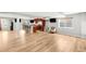 Spacious finished basement featuring wood floors, recessed lighting, entertainment bar, and daylight window at 23427 Song Bird Hills Pl, Parker, CO 80138