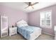 Charming bedroom with a white bed frame and shuttered window at 23427 Song Bird Hills Pl, Parker, CO 80138