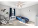 Playful bedroom with a unique car-shaped bed and cozy reading nook at 23427 Song Bird Hills Pl, Parker, CO 80138