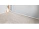 Bright bedroom featuring neutral carpeting, and access to the hallway through a white door at 23427 Song Bird Hills Pl, Parker, CO 80138