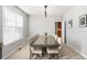 Elegant dining room with large window, neutral color palette, and a spacious table with seating at 23427 Song Bird Hills Pl, Parker, CO 80138