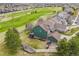 Aerial view of home featuring a large yard, mature trees, and a partial view of a golf course at 23427 Song Bird Hills Pl, Parker, CO 80138