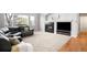 Comfortable living room features a fireplace, mounted television, and a large sectional for relaxation at 23427 Song Bird Hills Pl, Parker, CO 80138