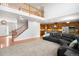 Open-concept living room flowing into the kitchen area with hardwood floors and high ceilings at 23427 Song Bird Hills Pl, Parker, CO 80138