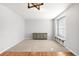 Spacious living room with carpet and hard wood flooring, featuring a large window and storage with a bench seat at 23427 Song Bird Hills Pl, Parker, CO 80138